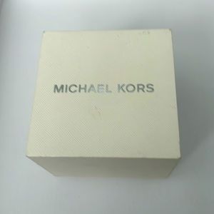 This is a Michael Kors watch. It has a Tan leather band that doubles around!
